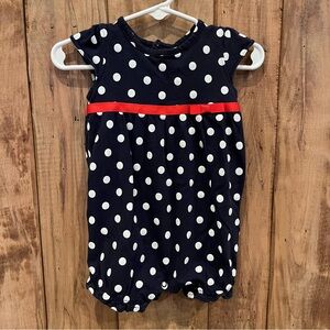 Navy polka dotted one piece with red ribbon